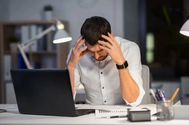 Stressed professional working late
