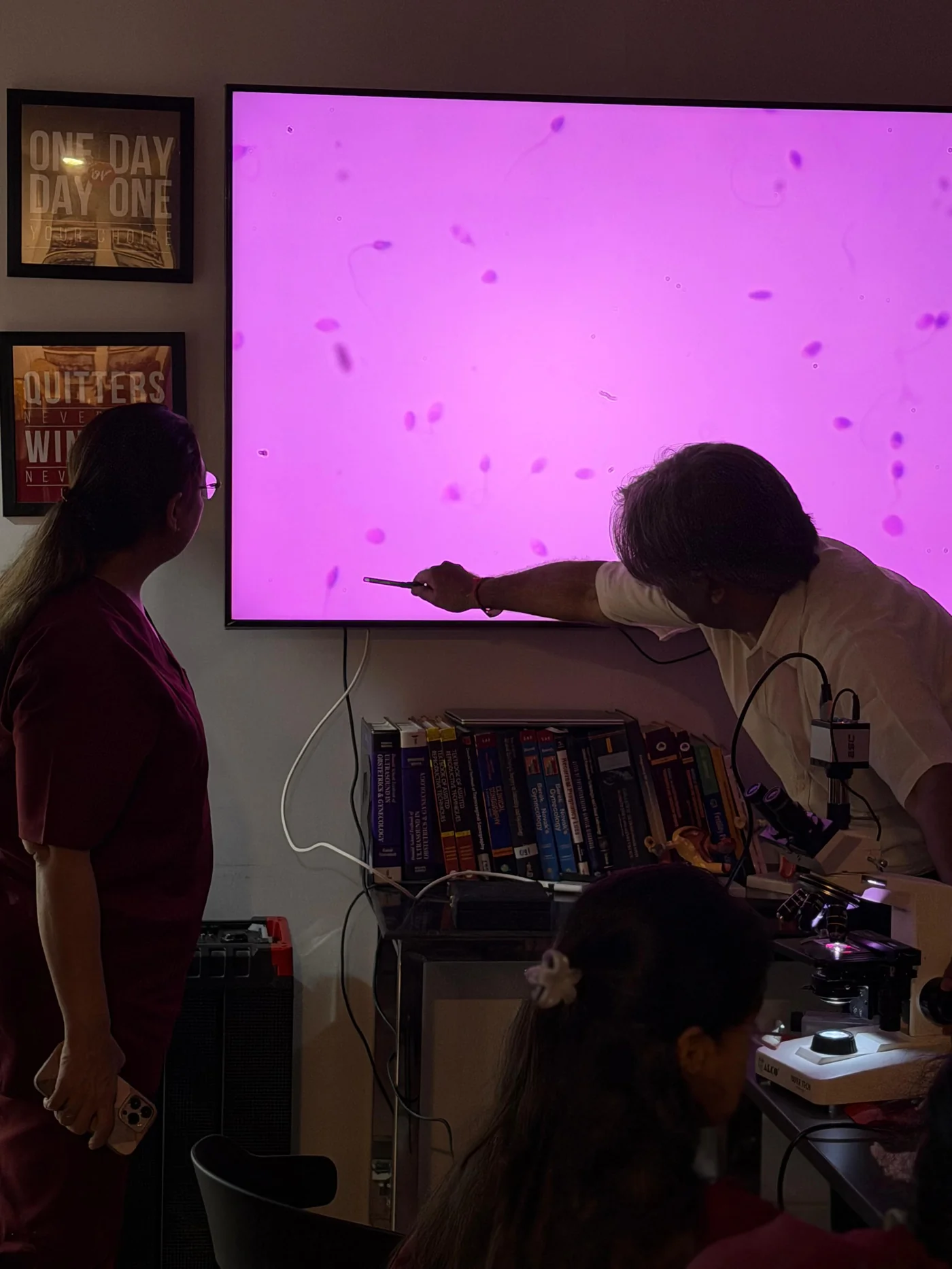 Stained sperm morphology under the microscope, projected during an andrology workshop in Delhi